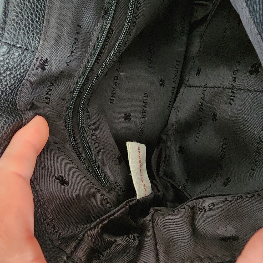 Lucky Brand black leather purse with magnetic tassle closure. It is 10"x10". - Picture 2 of 7